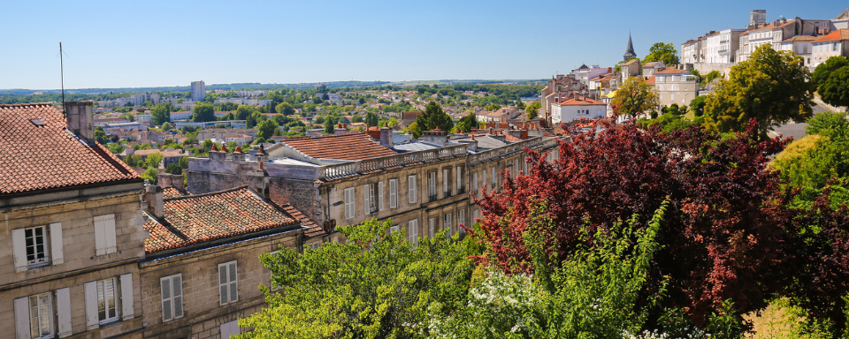 View of houses and trees on a hillside in Angoulême, France.